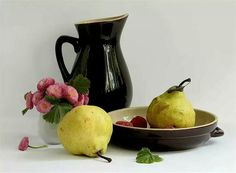 two pears in a bowl next to a vase with flowers and strawberries on it