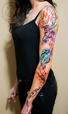 a woman with a tattoo on her arm