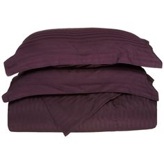 two pillows are stacked on top of each other in front of a white background with the word plum written below it