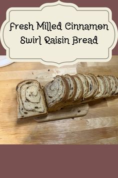 fresh milled cinnamon swirl raisin bread on a cutting board with the words, fresh milled cinnamon swirl raisin bread