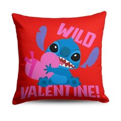 a red pillow with an image of a blue cartoon character on it that says wild valentine