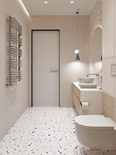 a bathroom with two sinks, a toilet and a radiator in the wall