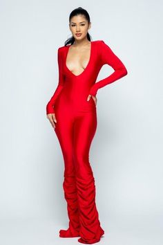 This jumpsuit makes a statement! Perfect for holiday parties. This sweet, yet spicy long sleeve jumpsuit features a deep v neck and tiered ruched pant legs. Flirty Long Sleeve Jumpsuits For Night Out, Red Bodysuit For Fall Party, Stretch Long Sleeve Jumpsuits And Rompers For Party, Stretch Long Sleeve Jumpsuit For Party, Flirty Long Sleeve Jumpsuits And Rompers For Party, Fitted Ruched Jumpsuits And Rompers For Night Out, Fitted Flirty Long Sleeve Jumpsuits And Rompers, Stretch Jumpsuits And Rompers For Fall Parties, Ruched Jumpsuits And Rompers For Night Out