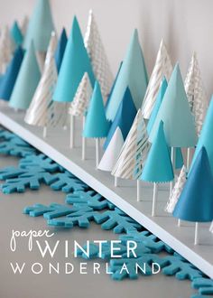 paper winter wonderland trees lined up in rows