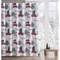 a shower curtain with christmas trees and cars on it