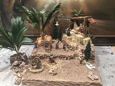 a nativity scene is displayed on a table