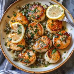 a white plate topped with shrimp and peas