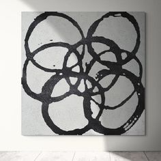 a black and white abstract painting on a wall