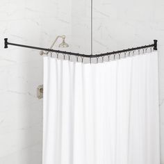 a white shower curtain in a bathroom