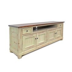 a large white entertainment center with wooden top