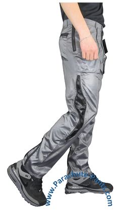 Awesome nylon Countdown Parachute Pants will bring you back to the 80s in no time. Break dancing is optional, but you’ll make a swooshing noise when you walk. These are the original shiny nylon Parachute Pants with the manufacturer’s label attached. The pants come with two front expanding zippered pockets and one rear pocket. The long zippers on the legs open to reveal a contrasting material. There are also zippers at the bottom of each leg that optionally creates the 80s ankle tight look. These Plastic Pants Walmart, Fitted Nylon Parachute Pants, Parachute Pants 80s, 1980s Parachute Pants, Stretch Nylon Wide-leg Parachute Pants, Stretch Full-length Nylon Parachute Pants, Sporty Nylon Parachute Pants With Moisture-wicking, Break Dancing, Back To The 80s