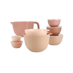 a group of bowls and cups sitting next to each other