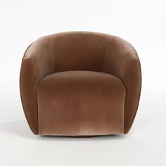 a brown chair sitting on top of a white floor