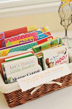 a basket filled with lots of books on top of a table