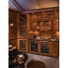 a wine cellar with lots of bottles and glasses