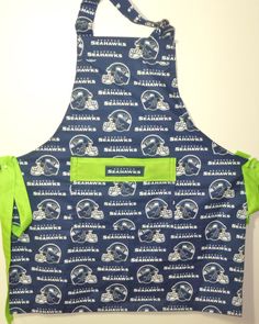 a blue and green apron with seattle rams on it