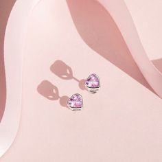 Love is in the air with these adorable 7mm cubic zirconia earrings for toddlers and little girls! The perfect size for all ages, these heart earrings for kids are crafted in 925 sterling silver and use first quality CZ stones. These hypoallergenic girl's earrings are completely safe for children with sensitive skin. The posts are threaded and feature a safety back system to ensure your child's earrings stay comfortably in place. These toddler & young girl earrings make a perfect gift for any occ Pink Cubic Zirconia Earrings For Mother's Day, Mother's Day Heart-shaped Birthstone Earrings, Mother's Day Heart Shaped Birthstone Earrings, Pink Sterling Silver Heart Earrings For Mother's Day, Hypoallergenic Cubic Zirconia Earrings For Valentine's Day, Valentine's Day Birthstone Earrings With Cubic Zirconia, Valentine's Day Birthstone Earrings In Cubic Zirconia, Sterling Silver Heart Earrings With Birthstone, Sterling Silver Heart Cut Birthstone Earrings