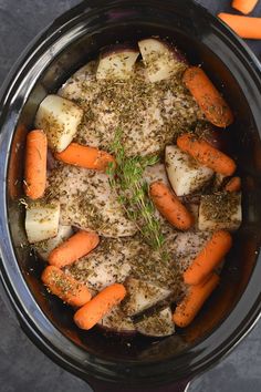 carrots, potatoes and herbs in a pot with seasoning on the side for garnish