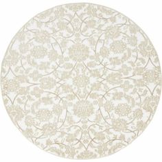 a white and beige rug with flowers on it