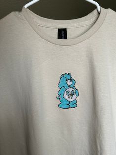 Care Bear Embroidered T Shirt Care Bear Shirt Care Bear - Etsy Cute Long Sleeve Embroidered T-shirt, Cute Crew Neck Tops With Custom Embroidery, Blue Custom Embroidery Short Sleeve Top, Casual Cotton T-shirt With Embroidered Patch, Blue Short Sleeve Top With Custom Embroidery, Cute White T-shirt With Machine Embroidery, Cute Embroidered Relaxed Fit Tops, Casual T-shirt With Embroidered Patch And Crew Neck, Casual Crew Neck T-shirt With Embroidered Patch