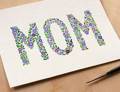 a mother's day card with the word mom painted on it