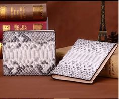 Item Type: Wallets Material: Snake Skin Lining Material: Genuine leather Interior: Photo Holder, Zipper Poucht, Cell Phone Pocket, Passcard Pocket, Coin Pocket, Note Compartment, Card Holder Wallet Length: Short Gender: Unisex Width: 2 cm Height: 10 cm Length: 11.5 cm Weight: 0.25 kg Designer Luxury Textured Leather Wallet, Luxury Artisan Rectangular Wallets, Skin Line, Photo Holder, Photo Holders, Interior Photo, Card Holder Wallet, Leather Interior, One Color