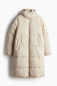 Long  padded jacket with a hood and stand-up collar. Zipper at front  welt front pockets  and long sleeves with concealed elastic at cuffs. Lined. Long Puffer Jacket Outfit, Long Puffer Jacket Women, Puffer Jacket Outfit, Womens Black Coat, Orange Coat, Leather Coat Womens, Long Puffer Jacket, Yellow Coat, Purple Coat