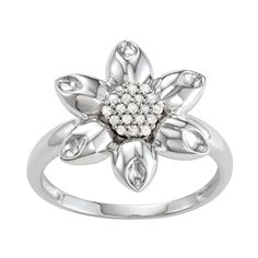 This sterling silver ring featuring a flower shape with 1/10 C.T. diamonds gives you a sparkling look.RING DETAILS Width: 16.10 mm. Metal: sterling silver Plating: rhodium Finish: polished  DIAMOND DETAILS Total weight 1/10 c.t. Shape: round Color: white Color grade: H,I Clarity: I2,I3 Setting: prong Diamond weights are approximate. Diamond total weights may vary between .01 and .08 ct. Some diamonds have fewer than 17 facets.Diamond equivalent carat (ct.) Total Weight (T.W.) represents the appr Diamond Flower Ring With Diamond Accents, Flower Shaped Diamond White Ring With Diamond Accents, White Diamond Flower-shaped Ring With Accents, Diamond White Flower-shaped Ring With Diamond Accents, White Gold Diamond Ring With Flower Accents, Diamond White Flower Shaped Diamond Ring, Flower Ring With Diamond Accents For Anniversary, Silver Flower-shaped Diamond Ring, White Gold Flower Shaped Diamond Ring