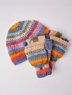 Every hat, hand-warmer and pair of Glittens in our collection is thoughtfully crafted with a lightweight fleece lining, ensuring both added insulation and enhanced comfort. This hand-knitted woolen hat, adorned with vibrant, soft wool yarn and a cozy fleece lining, is guaranteed to bring a touch of brilliance to your attire. The plush fleece interior offers additional warmth and coziness. For a perfectly coordinated ensemble, explore our matching Glove / Mittens (Glittens) and hand warmer option Cozy Multicolor Handmade Hat, Warm Multicolor Knit Hat, Cozy Multicolor Winter Hat, Warm Multicolor Winter Beanie, Hand-knitted Multicolor Hats For Cold Weather, Knitted Gifts, Colorful Knit, Woolen Hat, Knit Gloves