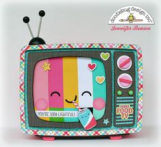 an old fashioned television is decorated with hearts and stars on the tv screen, as if it were from a children's book