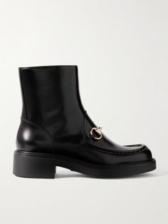 Gucci's signature horsebit was created in 1953 by the founder's sons as a tribute to their late father's love of all-things equestrian. Featuring a gold-tone version of the motif, these ankle boots are made from panels of patent-leather and set on chunky soles. Gucci Boots, Gucci Horsebit, Shoes Boots Ankle, Raffia Bag, Boot Pumps, Gucci Shoes, Ski Wear, Summer Hats, Leather Ankle Boots