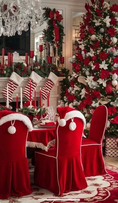 a dining room decorated for christmas with red velvet chairs and white table cloths, stockings and candy canes