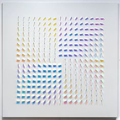 an abstract piece of art that appears to be made out of different colored lines and shapes