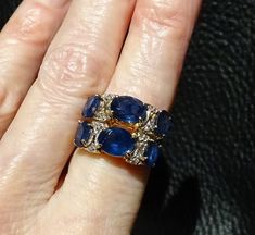 RARE and exquisite Kanchanaburi sapphire ring in excess of 6 carats accented with diamonds in a 14K gold setting The sapphires are the textbook perfect velvety blue coveted by gem collectors. This double band ring is an estate piece which I purchased in 1975. It is in fine condition. The setting is jeweler tested to 14K yellow gold. The gem carat weight is estimated since the gemstones are in the setting. The Kanchanaburi Sapphire gem gravels were discovered in 1918 and are located in the Bo Phl Luxury Sapphire Diamond Ring With 17 Jewels, Luxury Sapphire Diamond Ring With Single Cut, Luxury Sapphire Diamond Ring With Single Cut Diamonds, Luxury Sapphire Multi-stone Diamond Ring, Luxury Blue Sapphire Ring With 17 Jewels, Luxury Blue Diamond Ring With Single Cut Diamonds, Exquisite Sapphire Diamond Ring With 17 Jewels, Blue Luxury Diamond Ring With Rose Cut Diamonds, Luxury Blue Diamond Ring With Rose Cut