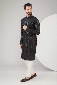 Black slub silk kurta with sequins and thread embroidery. Comes with a pant. - Aza Fashions Festive Long Sleeve Sequin Kurta, Fitted Sequin Kurta For Designer Wear, Party Sequin Straight Kurta, Fitted Sequined Kurta For Diwali, Fitted Sequin Kurta For Festive Occasions, Festive Black Sequined Kurta, Festive Fitted Sequin Kurta, Designer Black Traditional Wear With Sequins, Party Black Kurta With Sequins