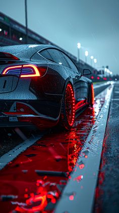 a black sports car with red lights on it's taillights parked in the rain