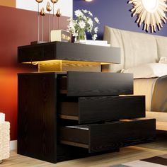 a bed room with a neatly made bed and a night stand on top of it