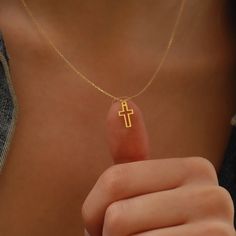 Delicately understated, the Gold Tiny Cross Necklace embodies simplicity and elegance, making it an ideal present for cherished individuals. Adorn it with self-assuredness, embracing its essence as a representation of both strength and spiritual connection. This classic design is perfect for any occasion, from casual to dressy. PRODUCT DETAILS: Material: 14K Solid Gold Choice of Gold Color: Yellow Gold, Rose Gold, White Gold Pendant Height: 12 mm Pendant Width: 0.6 mm Adjustable Length Closure: Dainty Cross Necklace, Tiny Cross Necklace, Cross Necklace Women, Necklace Christian, Crucifix Necklace, Tiny Cross, Christian Necklace, Gold Cross Necklace, Gold Cross Pendant