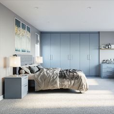 a bedroom with blue cabinets and a bed