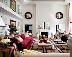 a living room filled with lots of furniture and decor