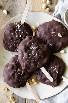 chocolate covered marshmallows on a white plate