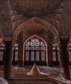 an intricately decorated building with arches and windows