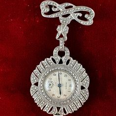 Fabulous Vintage 1920's Roxy Ladies Art Deco Marcasite Watch Brooch, Pendant Watch Made In Sterling Silver With Marcasite Settings The Silver Case Is 1.25 Inches In Diameter By 2.375 Inch Tall. The Roxy Watch Is 21/32 Inch In Diameter With Blue Hands & Black Markers . There Is A Small Sub Dial Second Hand, A Nice 17 Jewels Movement Hand Wind In A .925 Silver Case. This Exquisite Ladies Handmade Art Deco Watch Becomes A Family Heirloom . All The Stones Are Intact, It Winds & Runs, Is In Excellent Art Deco Watch, Pendant Watch, Quirky Jewelry, Crystal Structure, Art Deco Brooch, Vintage Timepiece, Iron Pyrite, Sterling Silver Marcasite, Pendant Watches