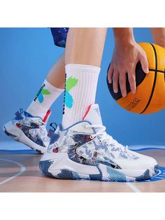 a basketball player with his foot on the floor holding a ball and wearing white socks