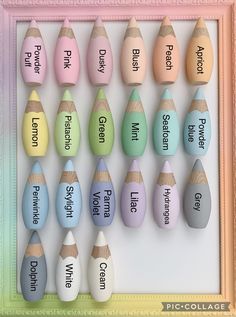 an assortment of different colored wooden crayons with words written on them in front of a pink frame