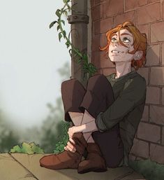 a young man sitting on the ground next to a brick wall with ivy growing over it