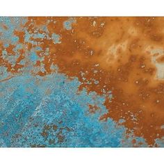 an old rusted metal surface with blue and orange paint