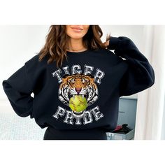 This makes the perfect vintage school spirit Tigers Softball sweatshirt! This tigers sweatshirt is great for showing your school spirit! This distressed vintage tiger and softball design is perfect on the popular Gildan brand sweatshirt. This vintage style sweatshirt will keep you warm throughout the softball season!  A pre-shrunk, classic fit sweater that's made with air-jet spun yarn for a soft feel and reduced pilling. ** P R O D U C T **  - 50% cotton, 50% polyester  - Pre-shrunk  - Classic fit  - Direct to Garment print (no stencils or vinyl which means it will last a lot longer)   - Printed and Shipped in the USA  - Due to different monitor screens colors may vary ** S I Z I N G **  - Consult size chart in listings for measurements  - Sizing is Unisex for all tees, runs true to size Team Spirit Sports Sweatshirt With Screen Print, Team Spirit Sweatshirt With Screen Print For Sports, Team Spirit Screen Print Sweatshirt, College Style Sweatshirt With Graphic Print For Sports Season, Collegiate Sweatshirt With Screen Print For Sports Events, Baseball Season Crew Neck Sweatshirt With School Spirit, School Spirit Crew Neck Sweatshirt For Baseball Season, School Spirit Sweatshirt With Crew Neck For Baseball Season, School Spirit Sweatshirt For Sports Events