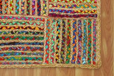 multicolored braided rug on wooden flooring