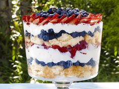 a trifle with strawberries and blueberries in it